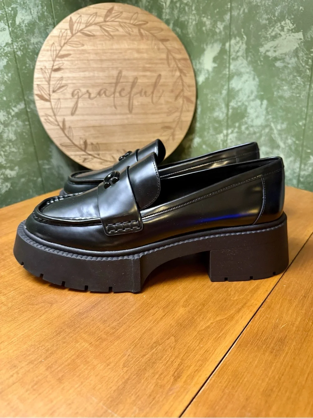 Coach polished black
